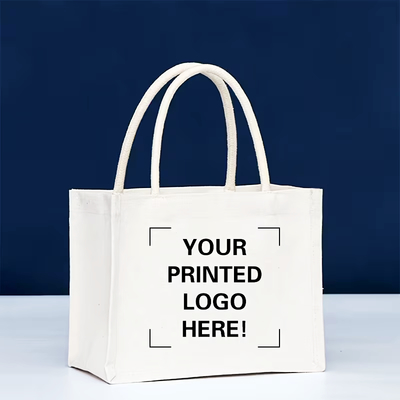 Canvas tote against blue background with handles visible