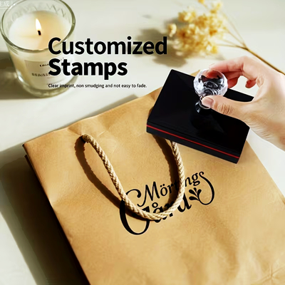 custom_merch_goods_rest_11_04_06_2026 Stamp on kraft bag with "Morning" text