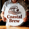 custom_merch_goods_rest_26_04_06_2026 Coastal Brew circular acrylic sign